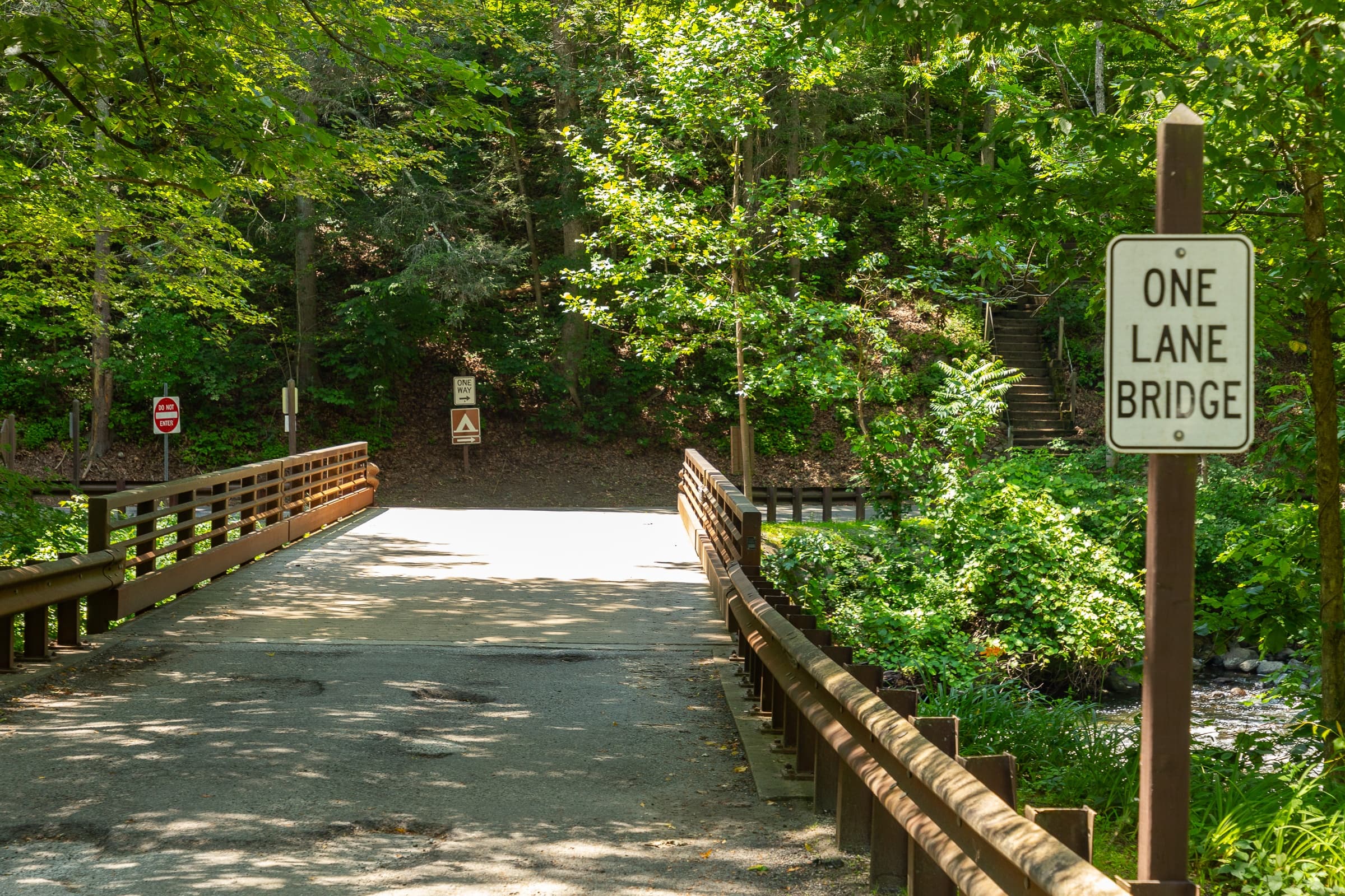 A bridge with a sign that says