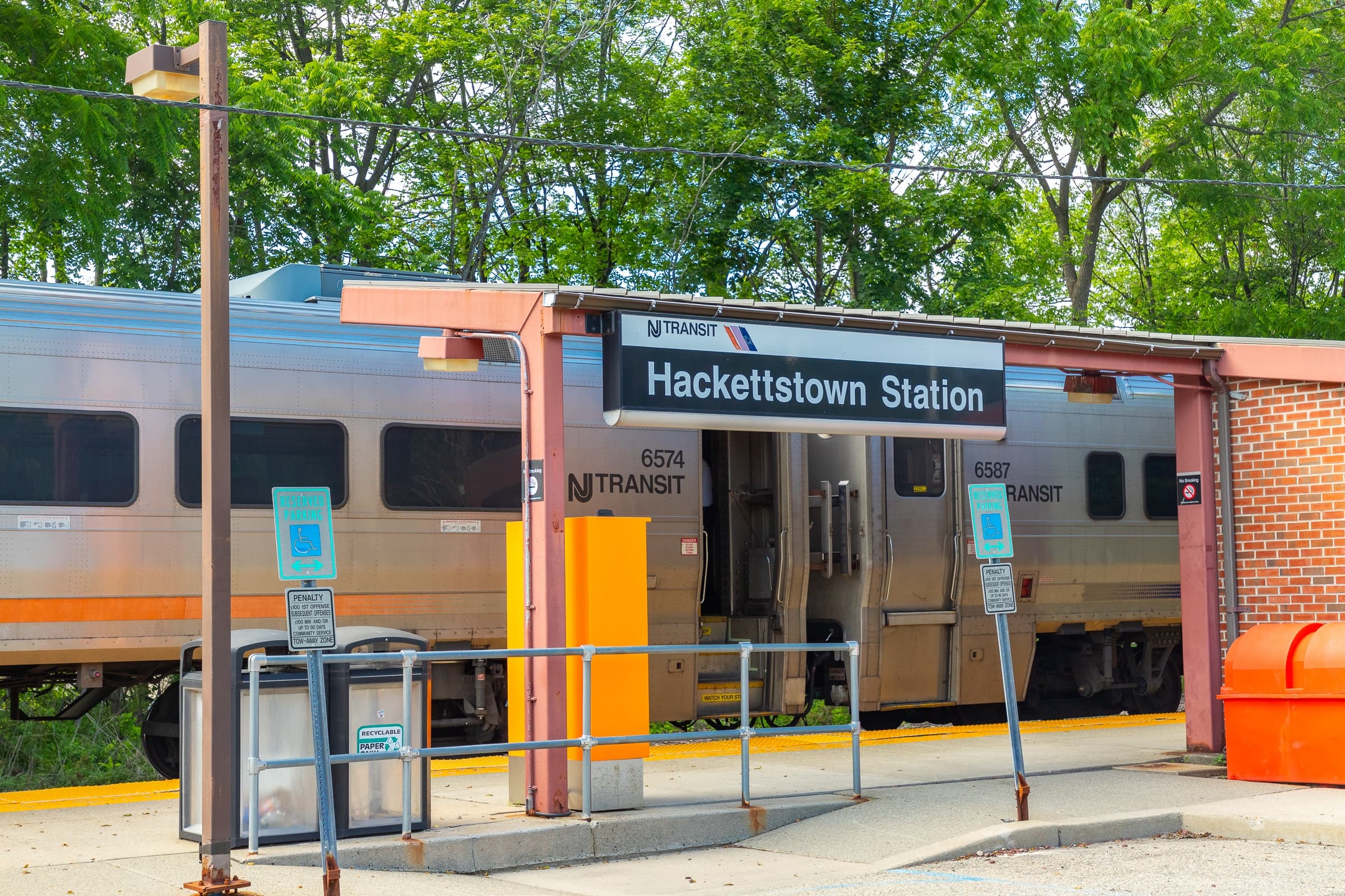 A train is parked at Hackettstown Station.