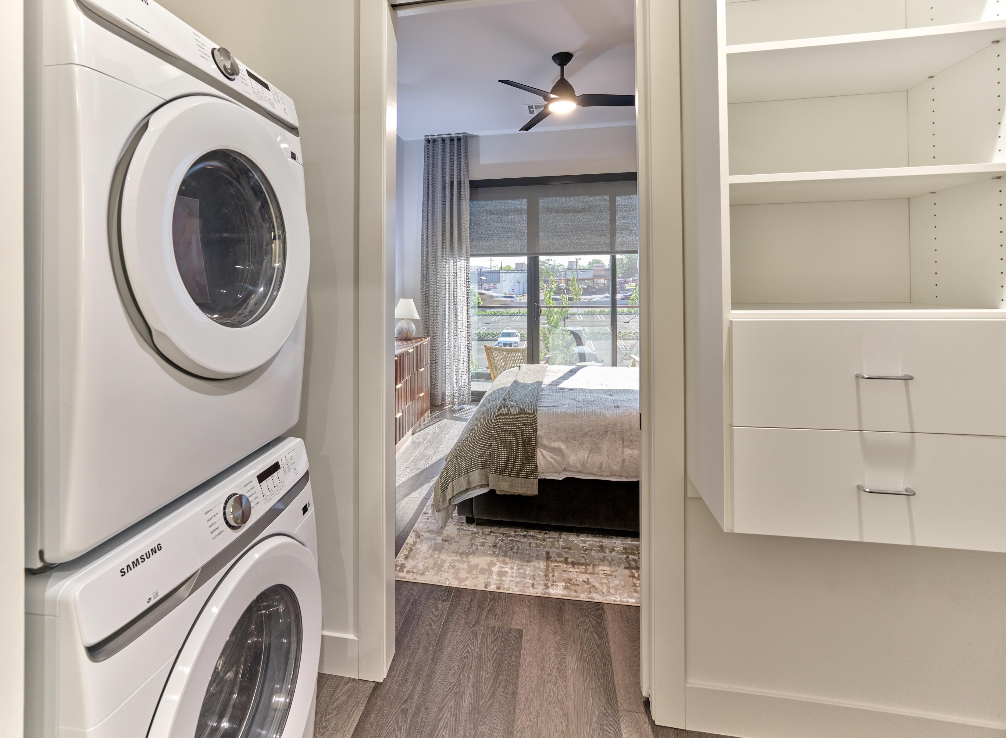 A white washing machine and dryer in a laundry room.