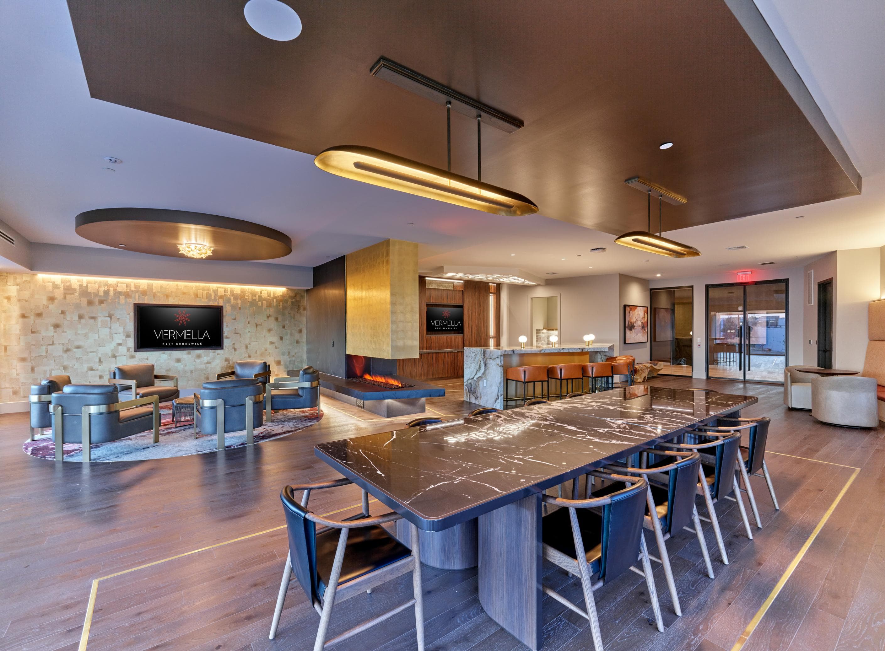 A conference room with a long table and chairs.