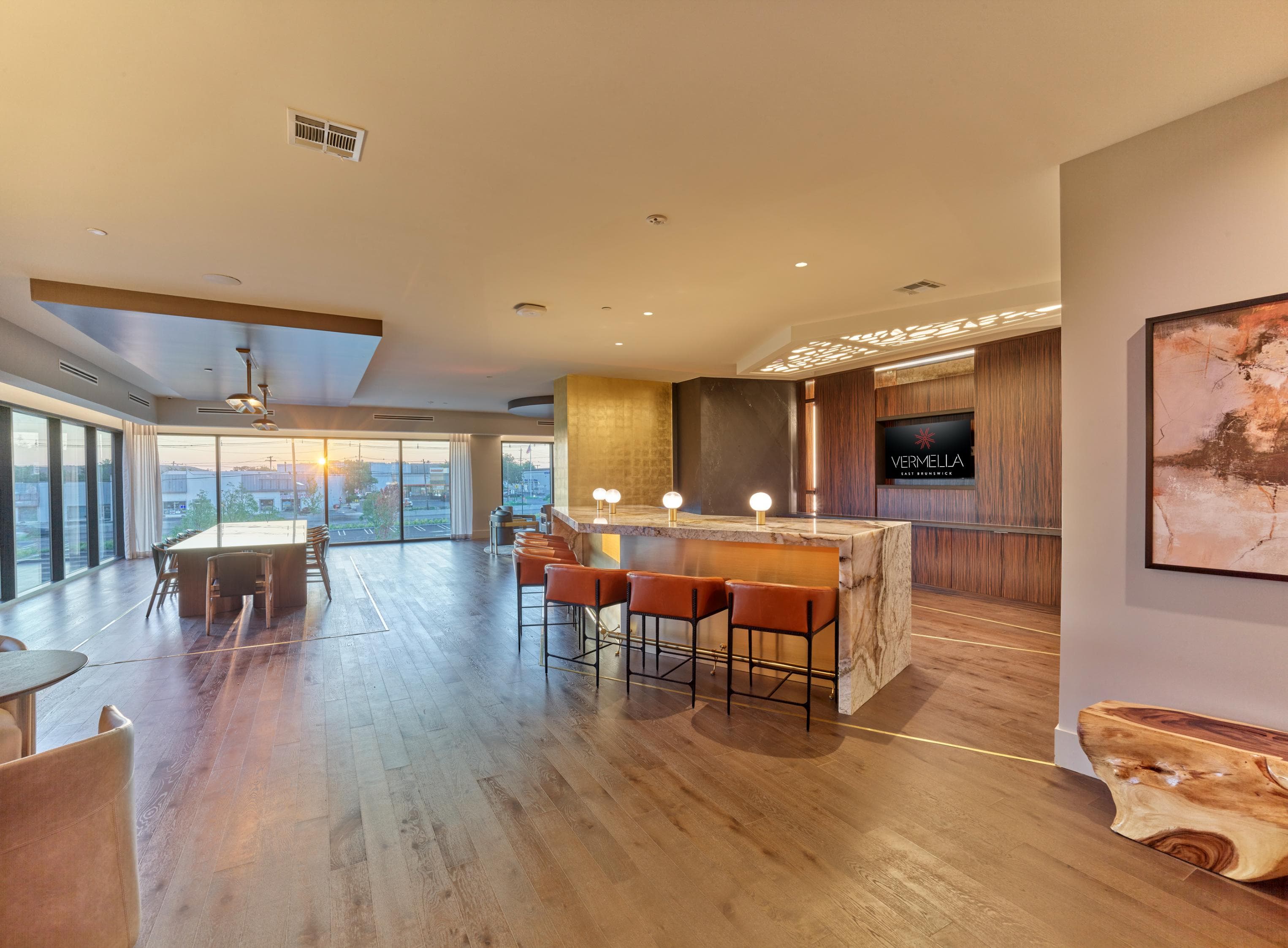 A modern living room with wooden floors and furniture.