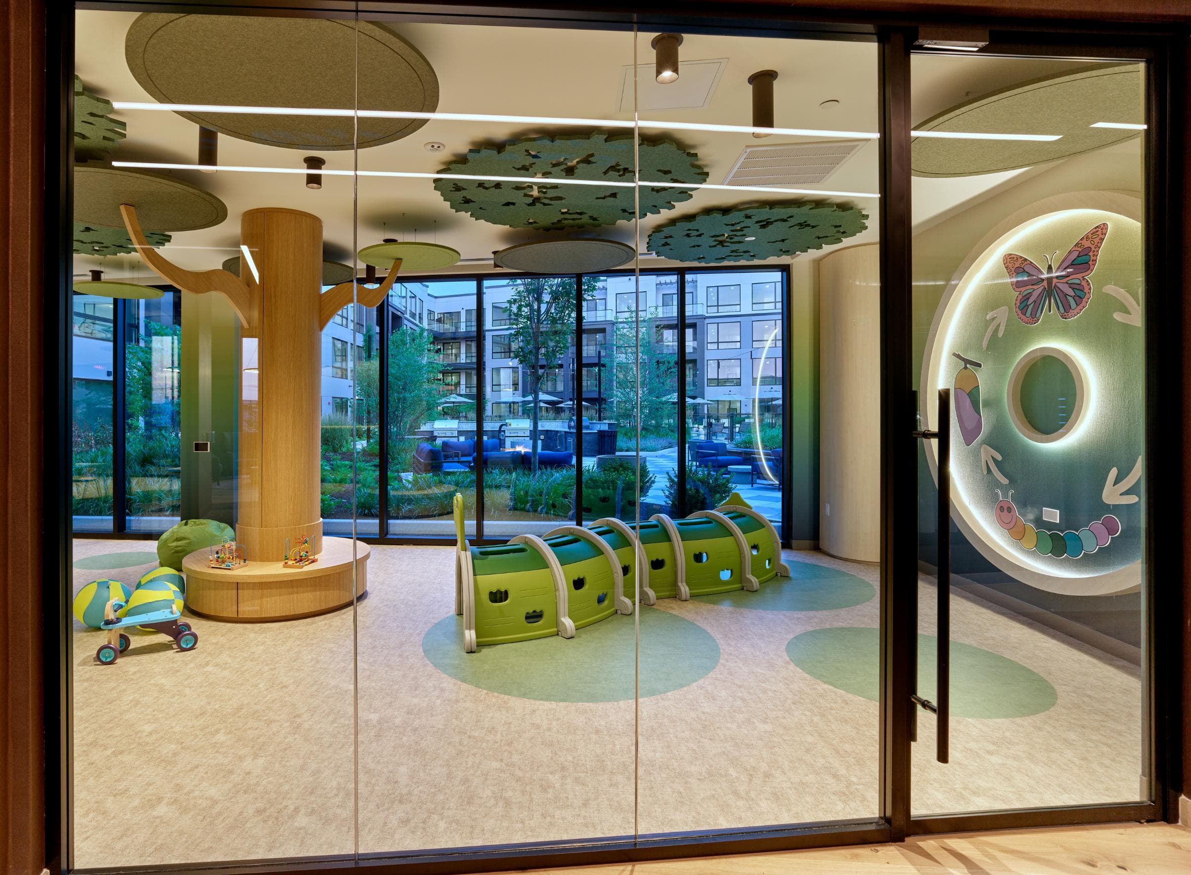 A glass door with a butterfly design on the right side.