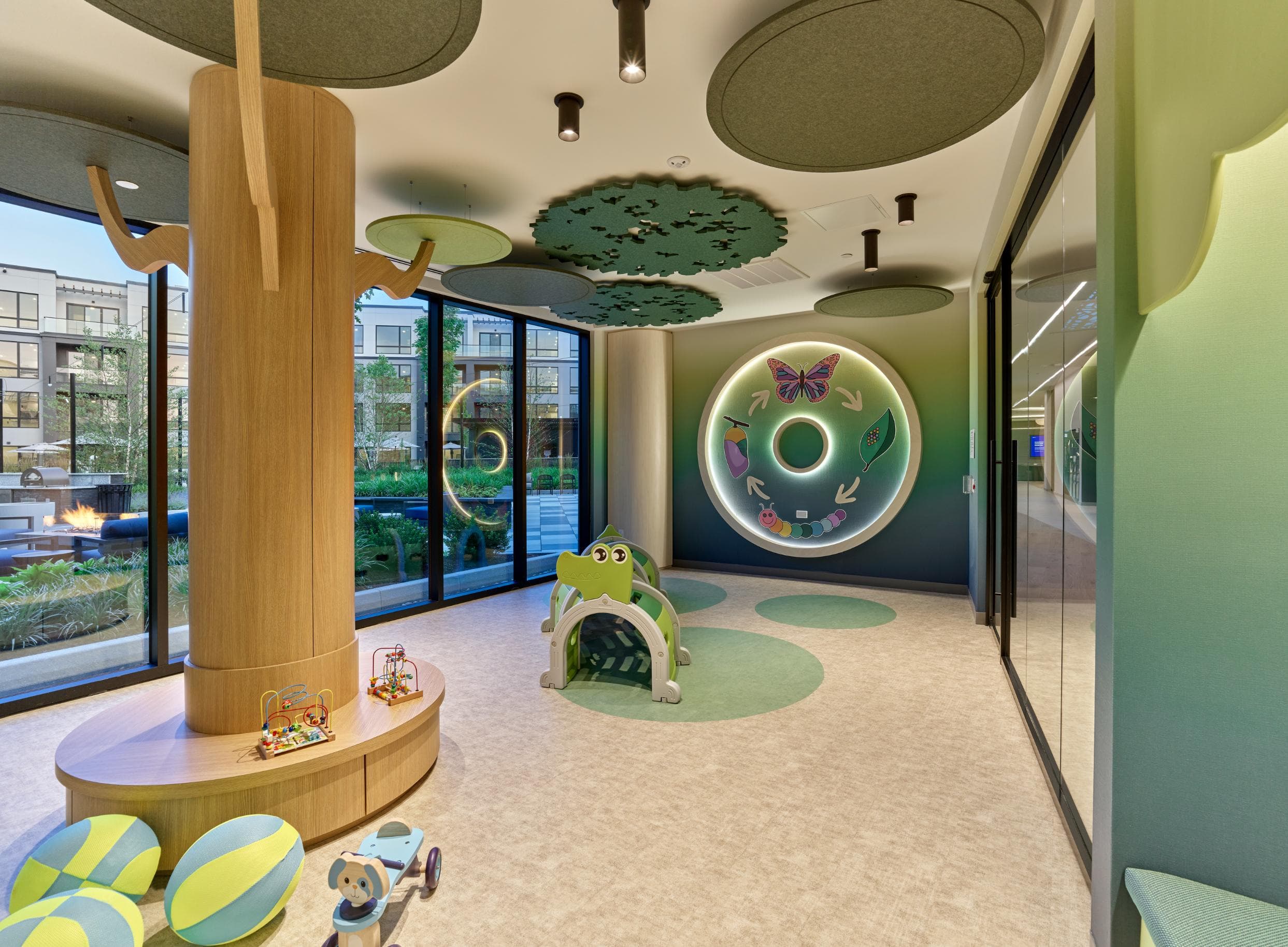 A children's play area with a green and yellow theme.