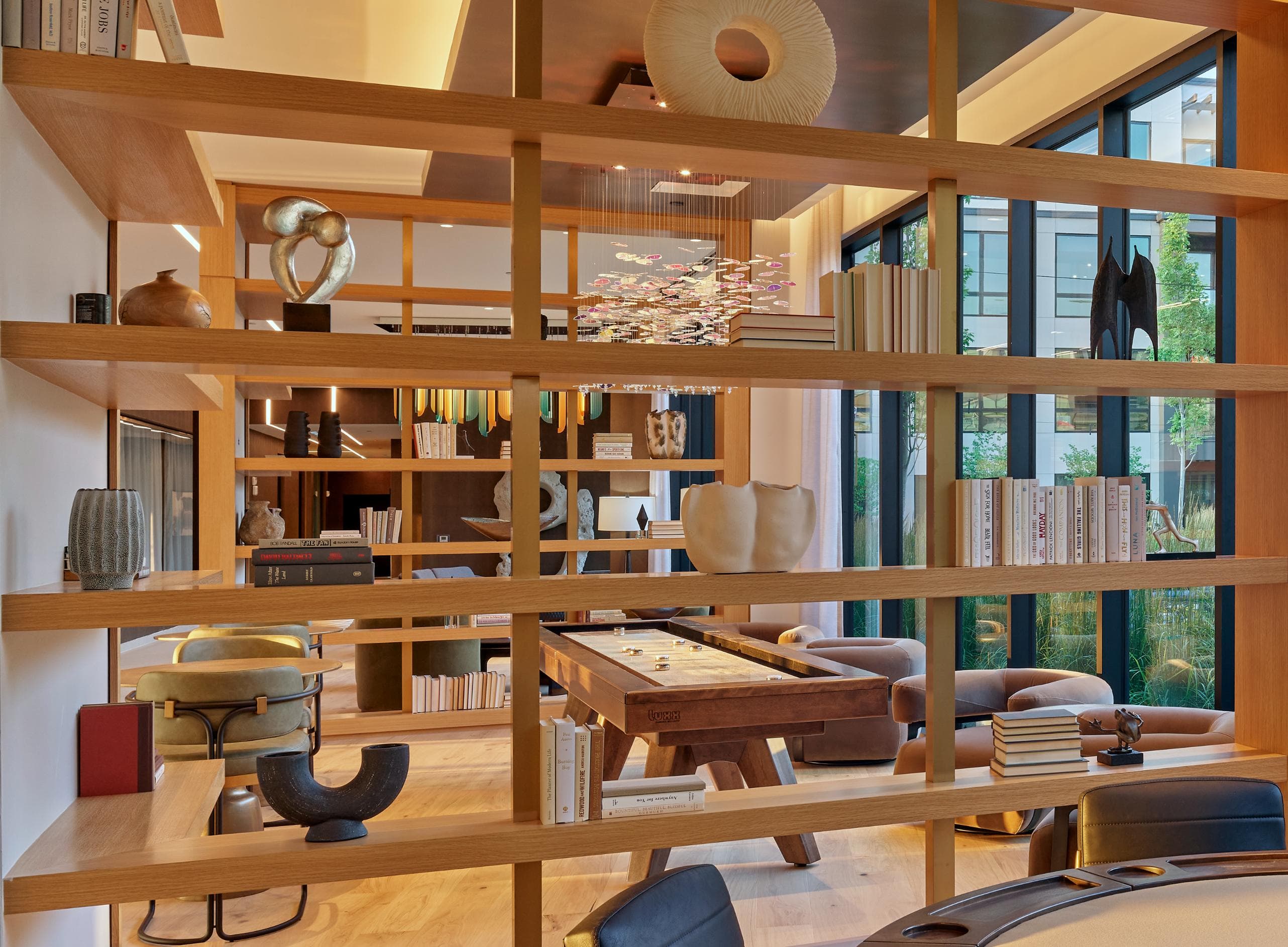 A room with a lot of shelves and a table.