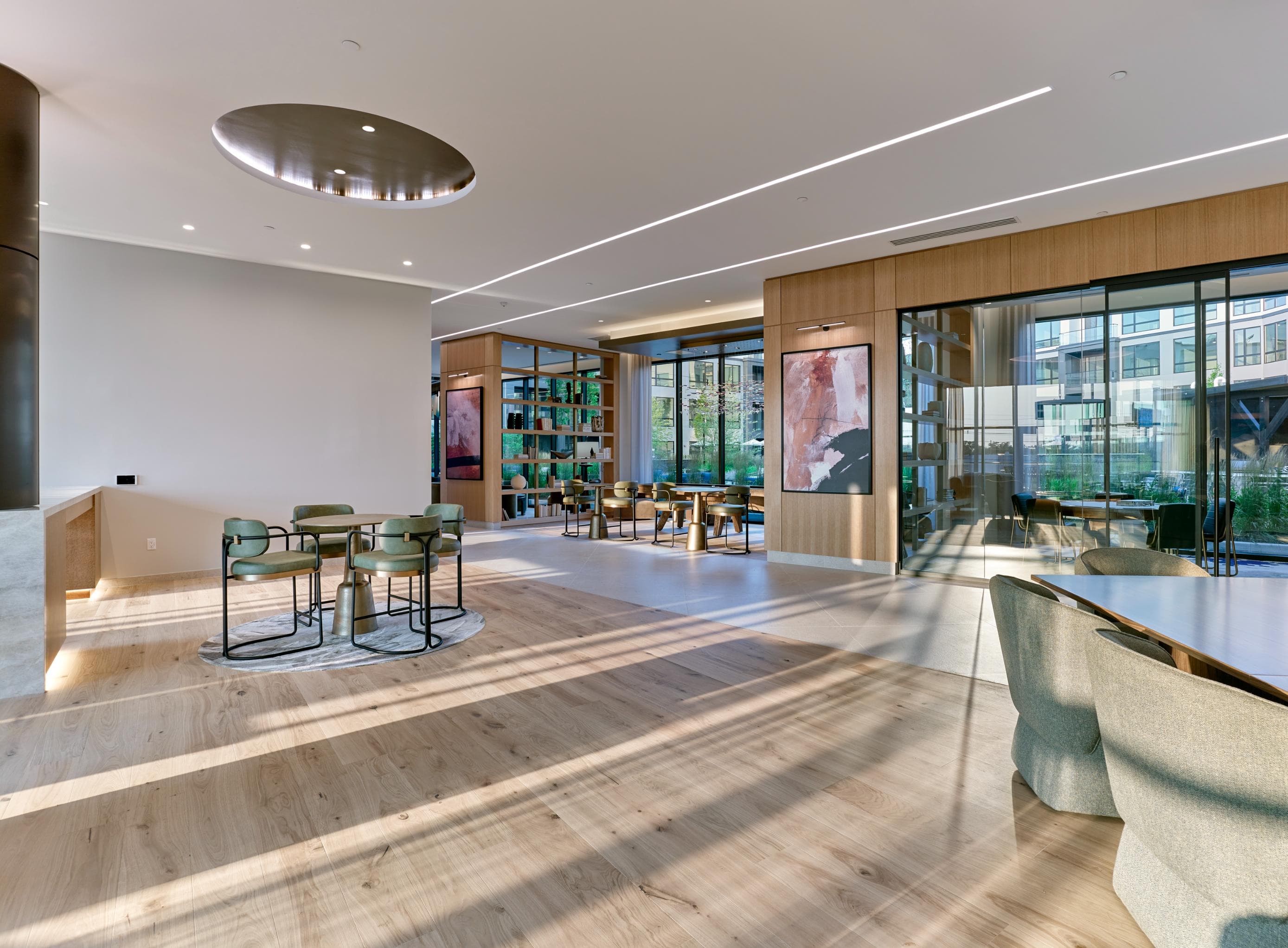 A modern interior with a wooden floor and a large window.