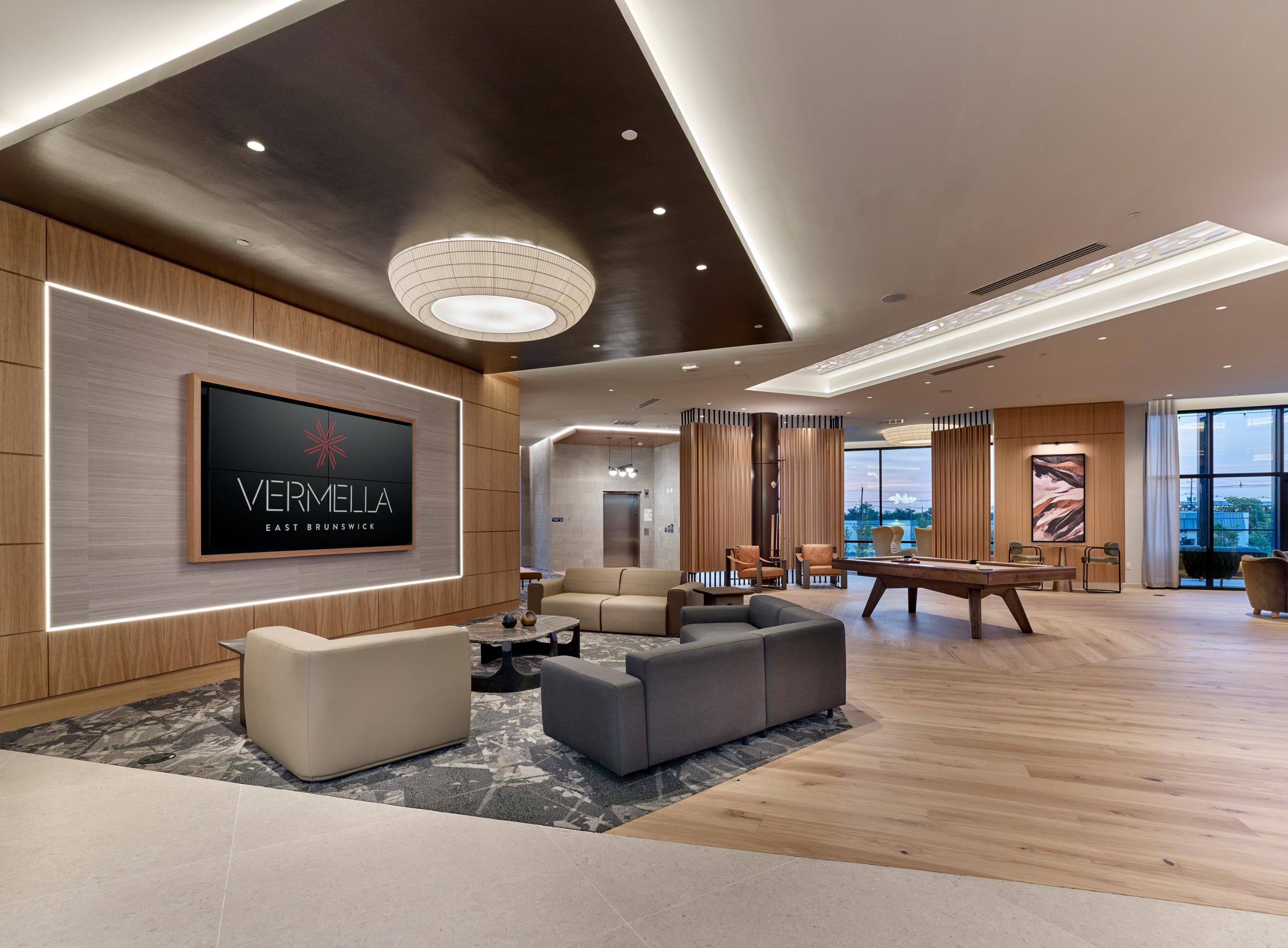 A living room with a Vermeila sign on the wall.