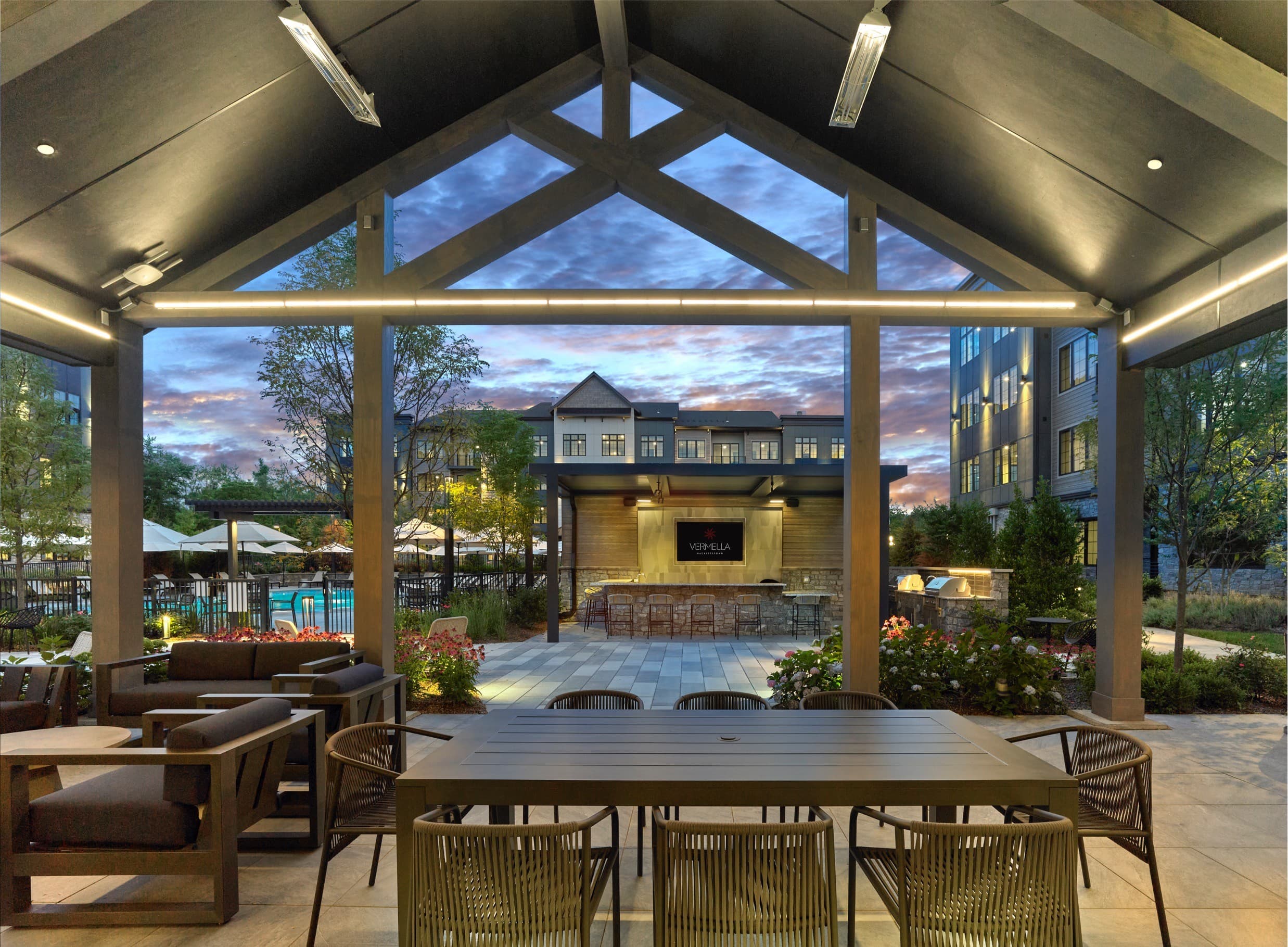 A patio with a table and chairs is set up outside.