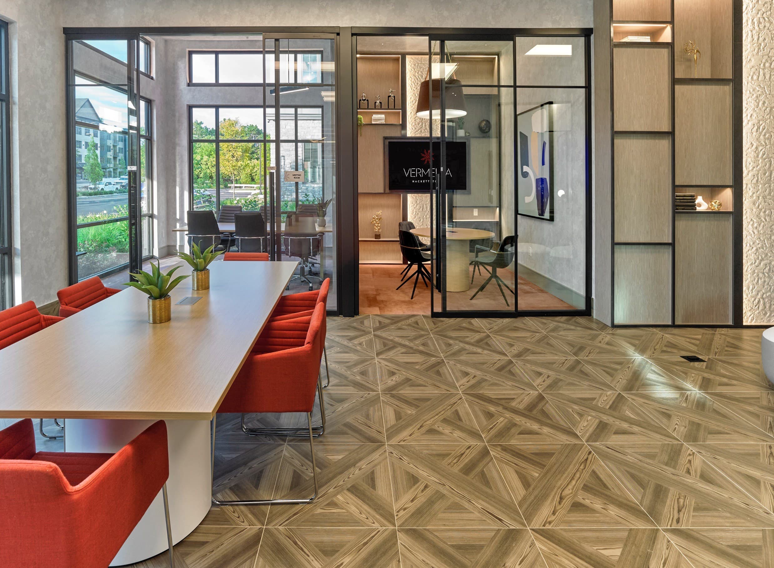 A conference room with a Vertex sign on the door.